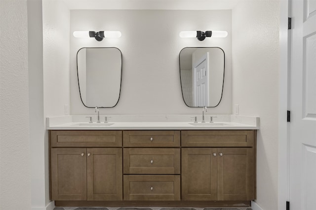4524 Boston Dr, Plano, TX 75093 - bathroom with a sink, baseboards, and double vanity
