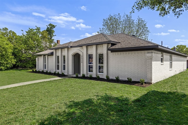 4524 Boston Dr, Plano, TX 75093 - view of front of home with brick siding, a shingled roof, and a front yard