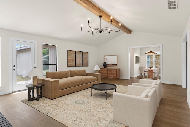 4524 Boston Dr, Plano, TX 75093 - living room with vaulted ceiling with beams, a notable chandelier, visible vents, and wood finished floors