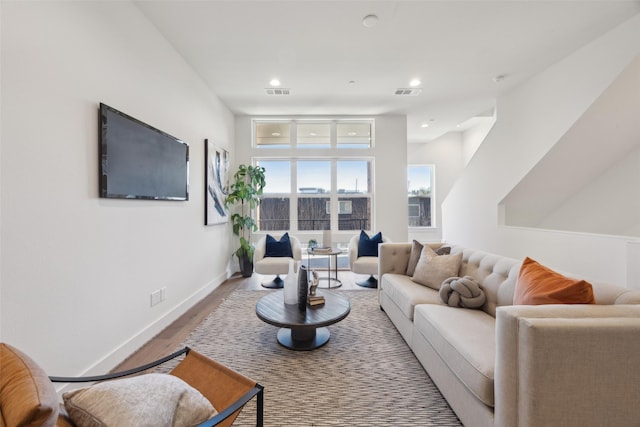 3040 Chimes St, Dallas, TX 75219 - living room with wood finished floors, baseboards, and recessed lighting