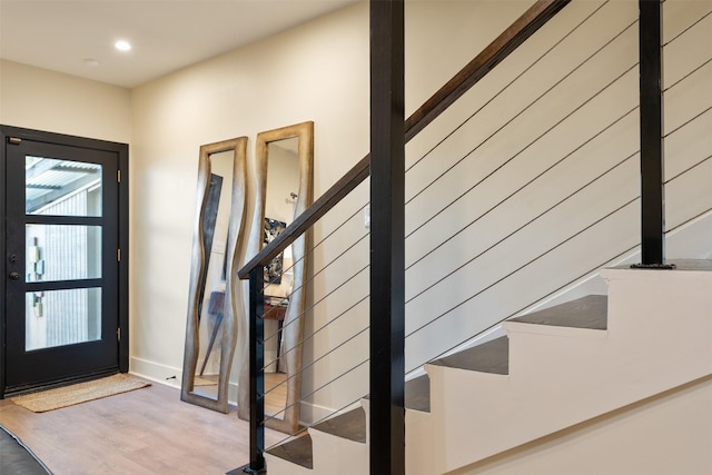 7404 W NW Hwy Unit 9, Dallas, TX 75225 - entrance foyer featuring recessed lighting, baseboards, stairs, and wood finished floors