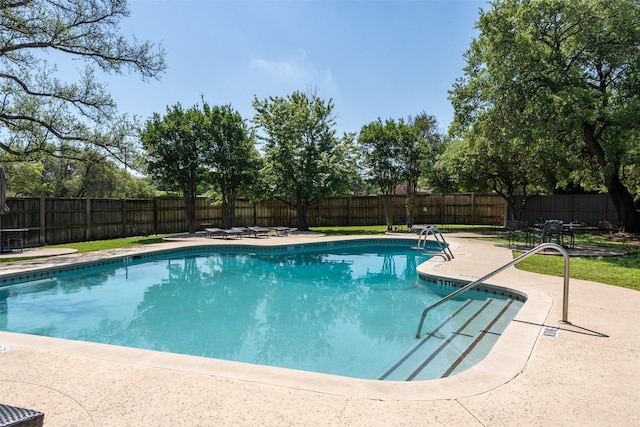 7404 W NW Hwy Unit 9, Dallas, TX 75225 - view of swimming pool with a fenced in pool, a fenced backyard, and a patio area