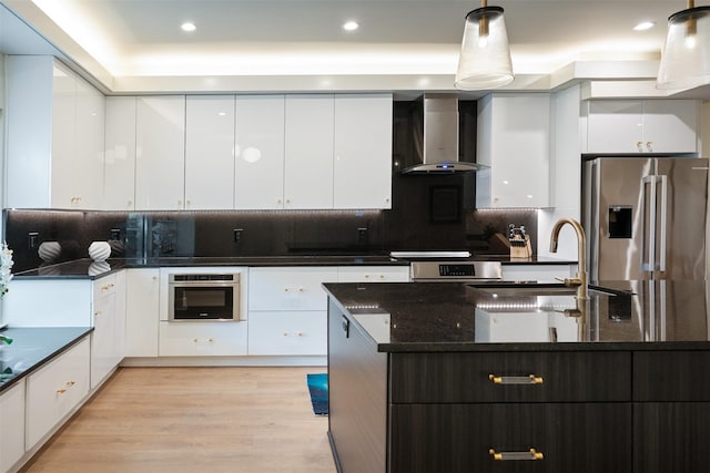 7404 W NW Hwy Unit 9, Dallas, TX 75225 - kitchen featuring a sink, wall chimney exhaust hood, modern cabinets, and stainless steel appliances