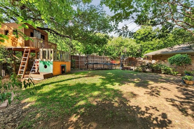 view of yard featuring a fenced backyard and stairway