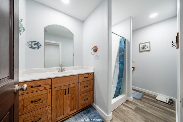 3734 Fm 600 S, Anson, TX 79501 - bathroom with wood finished floors, baseboards, vanity, and a stall shower