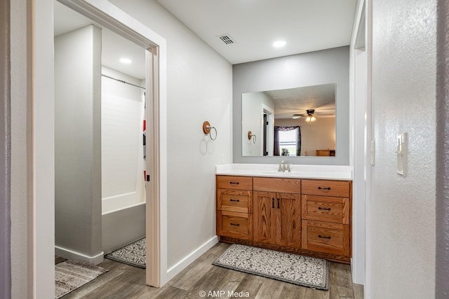 3734 Fm 600 S, Anson, TX 79501 - full bath with visible vents, baseboards, wood finished floors, ceiling fan, and vanity