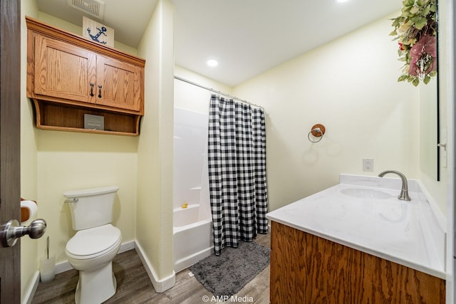 3734 Fm 600 S, Anson, TX 79501 - bathroom featuring wood finished floors, vanity, baseboards, toilet, and visible vents