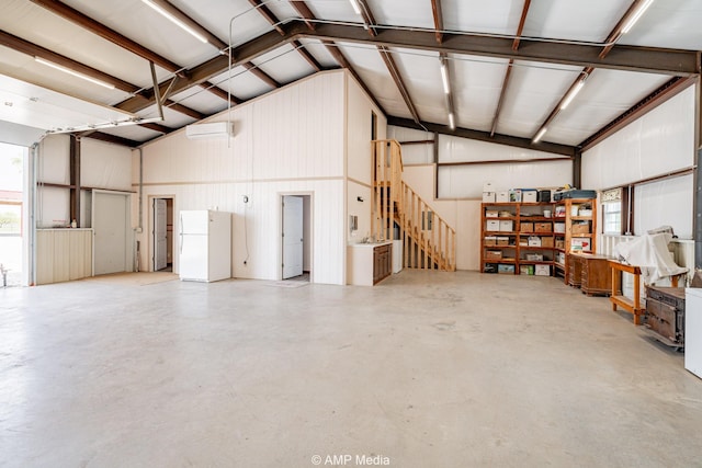 3734 Fm 600 S, Anson, TX 79501 - garage featuring freestanding refrigerator and a wall mounted air conditioner