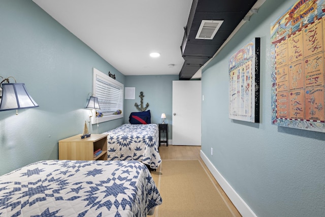 bedroom featuring recessed lighting, wood finished floors, visible vents, and baseboards