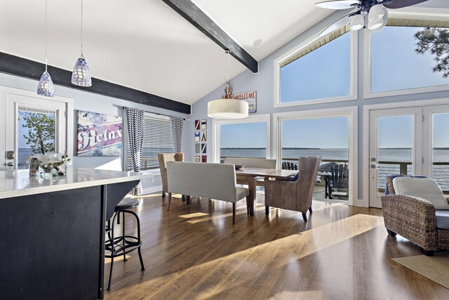 dining room with high vaulted ceiling, dark wood finished floors, a ceiling fan, and beamed ceiling