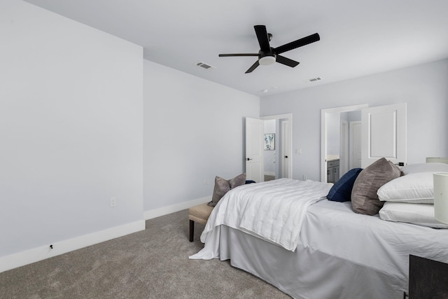 carpeted bedroom with visible vents, a ceiling fan, baseboards, and connected bathroom
