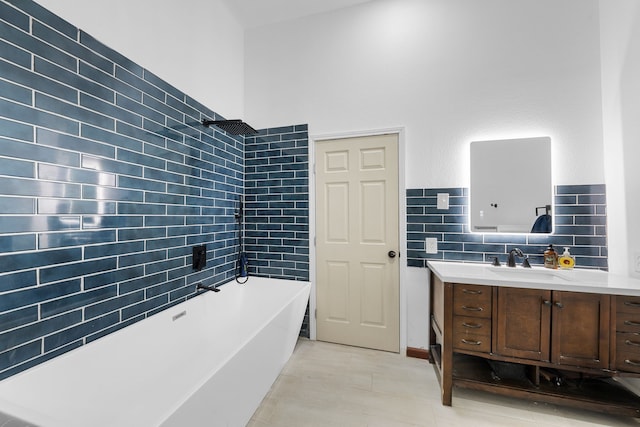 full bathroom featuring walk in shower, a freestanding tub, and vanity