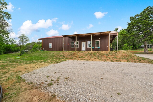 ranch-style house with an outbuilding and an outdoor structure