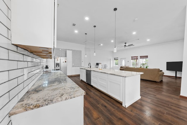 kitchen featuring white cabinets, dishwasher, light stone countertops, and open floor plan