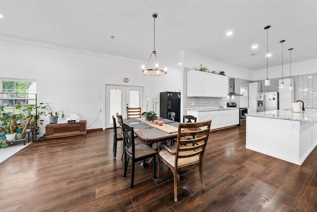 dining room featuring recessed lighting, a chandelier, dark wood-style floors, and french doors