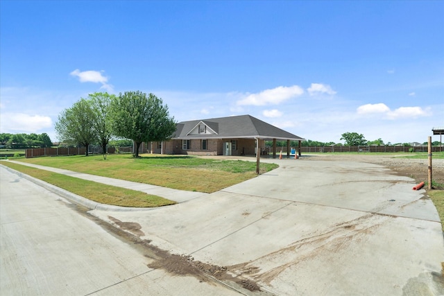 1631 E Farmers, Seagoville, TX 75159 - view of front of house featuring concrete driveway, a front lawn, fence, and covered porch