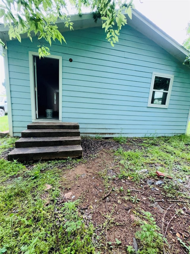 rear view of property with entry steps