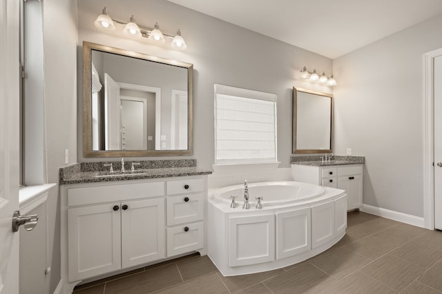 1001 Broadmoor Way, Roanoke, TX 76262 - bathroom with two vanities, a bath, tile patterned floors, and a sink
