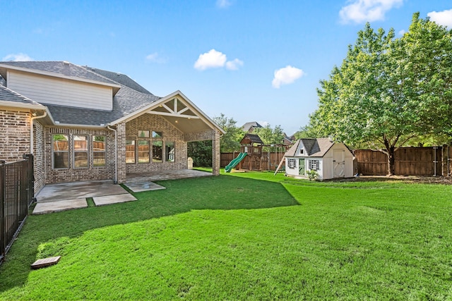 1001 Broadmoor Way, Roanoke, TX 76262 - view of yard with a patio area, a shed, a playground, a fenced backyard, and an outdoor structure