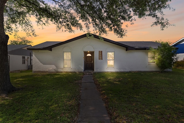 1501 Crockett St, Garland, TX 75042 - single story home featuring brick siding, a yard, and a shingled roof