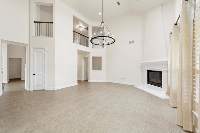 944 Abbott Ln, Allen, TX 75013 - unfurnished living room with high vaulted ceiling, a chandelier, a glass covered fireplace, baseboards, and tile patterned floors
