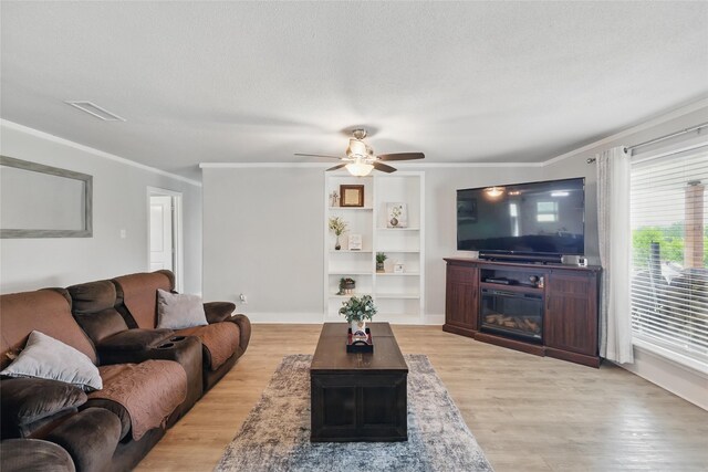 5247 Fm 1569, Farmersville, TX 75442 - carpeted spare room featuring a barn door, a ceiling fan, baseboards, a wall mounted AC, and ornamental molding