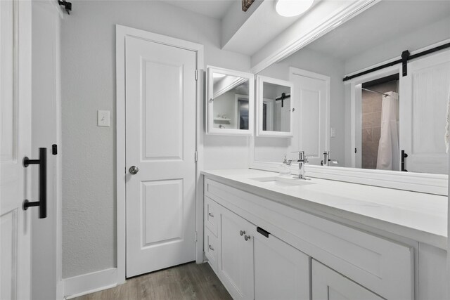 5247 Fm 1569, Farmersville, TX 75442 - unfurnished bedroom featuring baseboards, a barn door, carpet, and ornamental molding
