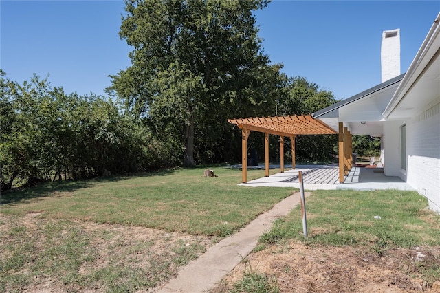 view of yard featuring a patio area and a pergola