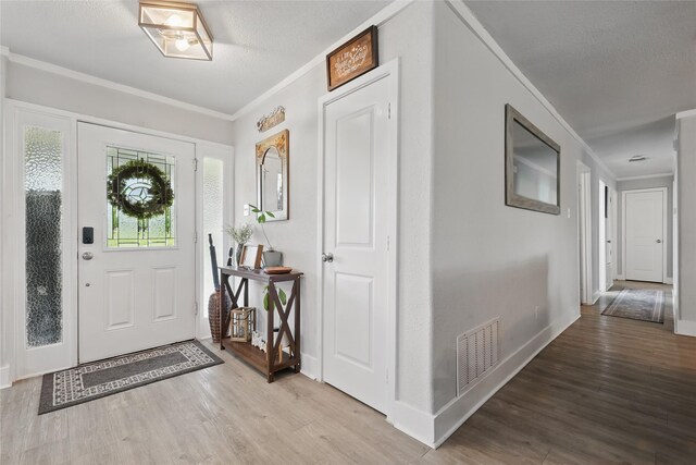 5247 Fm 1569, Farmersville, TX 75442 - kitchen featuring visible vents, light countertops, white cabinetry, stainless steel electric stove, and ornamental molding