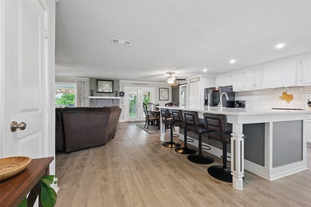 5247 Fm 1569, Farmersville, TX 75442 - kitchen featuring stainless steel range with electric cooktop, recessed lighting, white cabinetry, and a sink