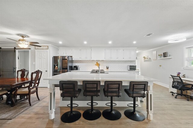 5247 Fm 1569, Farmersville, TX 75442 - kitchen with a wealth of natural light, ornamental molding, stainless steel electric range, and white cabinets