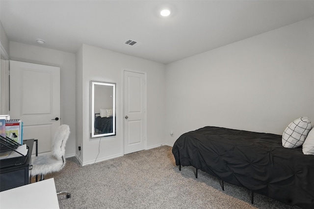 bedroom featuring visible vents, carpet flooring, and baseboards