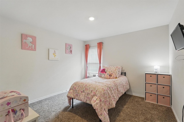 bedroom featuring carpet and baseboards