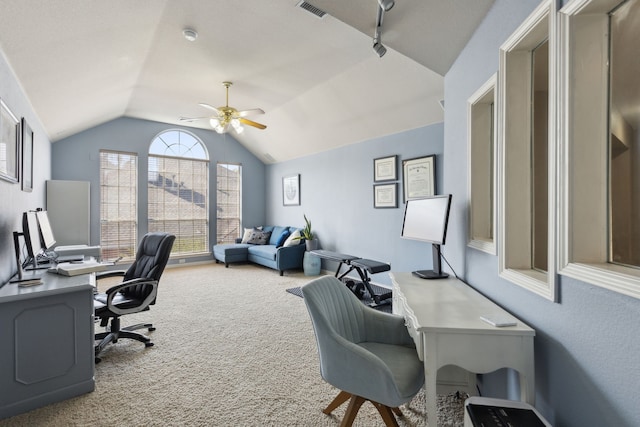 home office with a ceiling fan, lofted ceiling, carpet floors, and visible vents