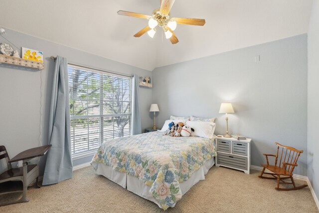 carpeted bedroom featuring lofted ceiling, baseboards, ceiling fan, and multiple windows