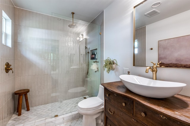 full bathroom with plenty of natural light, toilet, and walk in shower