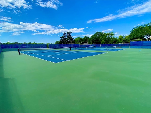 view of sport court with fence