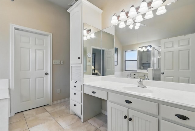 1220 Chaparral Ln, Granbury, TX 76048 - bathroom with tile patterned floors, vaulted ceiling, vanity, baseboards, and a stall shower