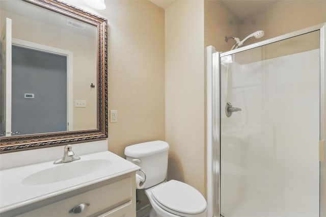 1220 Chaparral Ln, Granbury, TX 76048 - bathroom with vanity, toilet, a stall shower, and visible vents