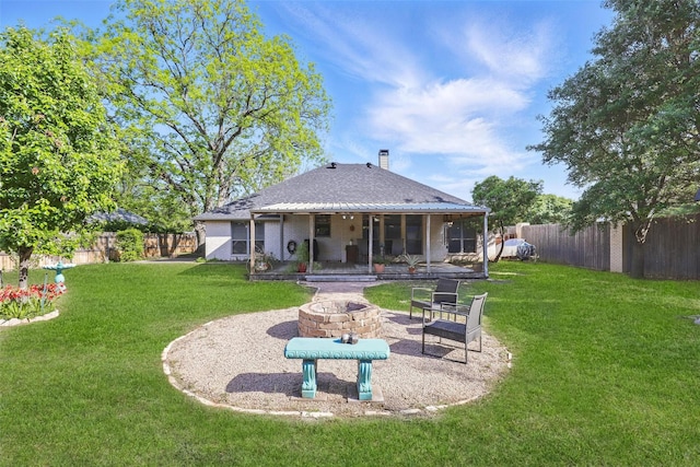 1220 Chaparral Ln, Granbury, TX 76048 - back of house featuring a patio area, a lawn, a chimney, an outdoor fire pit, and a fenced backyard