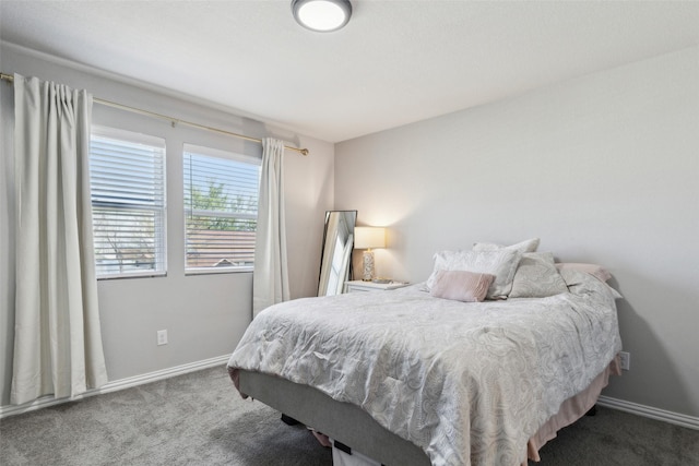 carpeted bedroom with baseboards