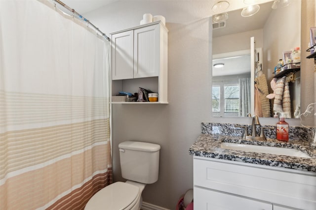 bathroom with a shower with curtain, toilet, baseboards, visible vents, and vanity