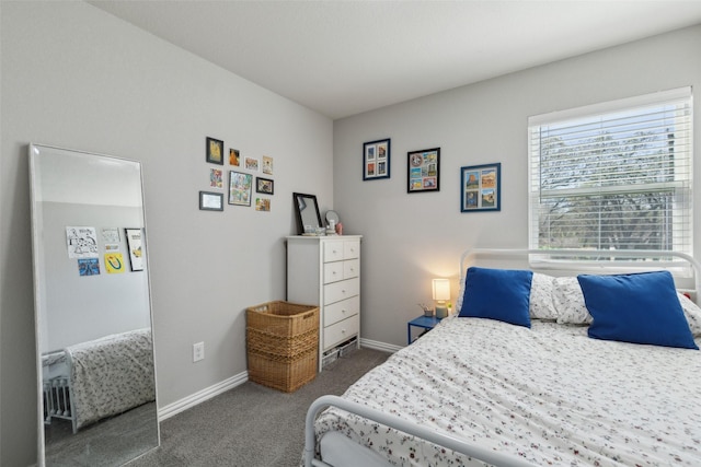 bedroom with carpet and baseboards