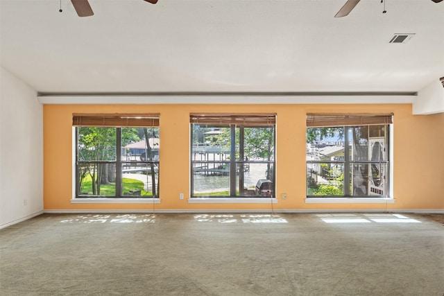 156 King Arthur Rd, Mabank, TX 75156 - unfurnished room featuring ceiling fan, plenty of natural light, and carpet flooring