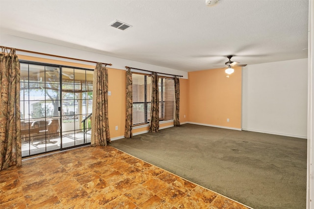 156 King Arthur Rd, Mabank, TX 75156 - spare room with a ceiling fan, carpet flooring, and baseboards
