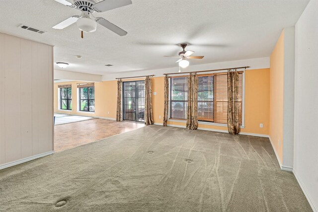 156 King Arthur Rd, Mabank, TX 75156 - carpeted empty room featuring a ceiling fan, baseboards, and a textured ceiling