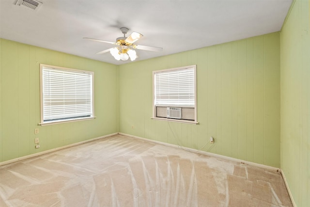 156 King Arthur Rd, Mabank, TX 75156 - unfurnished room with plenty of natural light, a ceiling fan, carpet, baseboards, and wooden walls