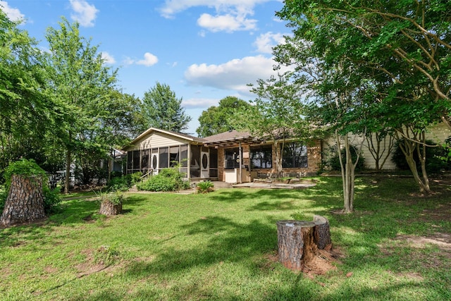 156 King Arthur Rd, Mabank, TX 75156 - back of property featuring a sunroom and a lawn