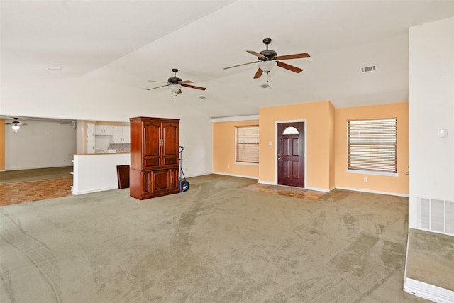 156 King Arthur Rd, Mabank, TX 75156 - unfurnished living room with lofted ceiling, ceiling fan, light carpet, and baseboards