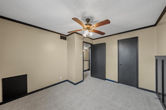 unfurnished bedroom featuring light carpet, baseboards, visible vents, and crown molding